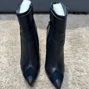 Navy blue ankle boots.